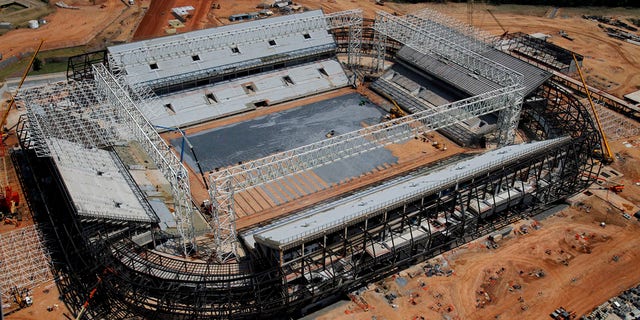 FILE - In this Sept. 2013 file photo released by Portal da Copa shows an aerial view of the Arena Pantanal stadium in Cuiaba, Mato Grosso state, Brazil. Brazil risks missing the December deadline for the delivery of its World Cup stadiums because of a court battle over the purchase of seats for this venue. (AP Photo/Edson Rodrigues, Portal da Copa, File)