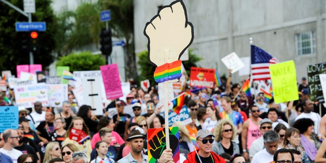 People participate in a Resist March that replaced the annual Pride Parade in Los Angeles, California, U.S., June 11, 2017. 
