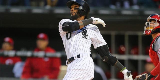 May 9, 2015; Chicago, IL, USA; Chicago White Sox shortstop Alexei Ramirez (10) hits a 2 run home run during the second inning in game two of a doubleheader against the Cincinnati Reds at U.S Cellular Field. Cincinnati won 10-4. Mandatory Credit: Dennis Wierzbicki-USA TODAY Sports