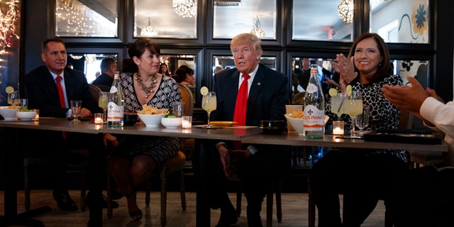 Republican presidential candidate Donald Trump meets with hispanic business leaders at El Sombrero Mexican Cafe, Wednesday, Oct. 5, 2016, in Las Vegas. (AP Photo/ Evan Vucci)