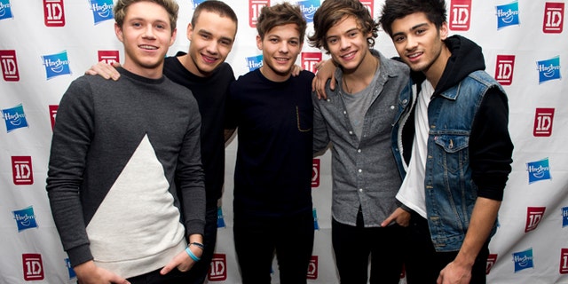This Nov. 26, 2012 file photo released by hasbro shows members of One Direction, from left, Niall Horan, Liam Payne, Louis Tomlinson, Harry Styles and Zayn Malik at a Hasbro press event in New York.