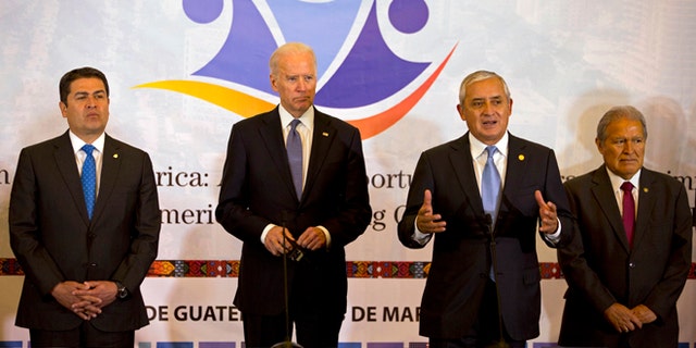 Honduras' President Juan Orlando Hernandez, left, U.S. Vice President Joe Biden, second left, and El Salvador's President Salvador Sanchez, right, stand as Guatemala's President Otto Perez Molina, second from right, talks during a working session in Guatemala City, Tuesday, March 3, 2015. Biden has arrived in Guatemala for a two-day visit with Central American presidents to discuss funding priorities aimed at slowing migration. (AP Photo/Moises Castillo)