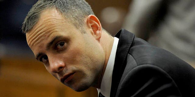 May 12, 2014: Oscar Pistorius sits in court for his ongoing murder trial in Pretoria, South Africa.