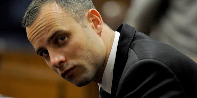 May 12, 2014: Oscar Pistorius sits in court for his ongoing murder trial in Pretoria, South Africa.