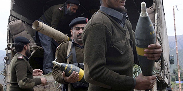 Mar. 3: Pakistan's paramilitary force carry ammunition confiscated from Taliban militants in Dara Adam Khel near Peshawar, Pakistan.