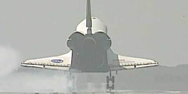 July 31: Space Shuttle Endeavour lands at the Kennedy Space Center, Florida.