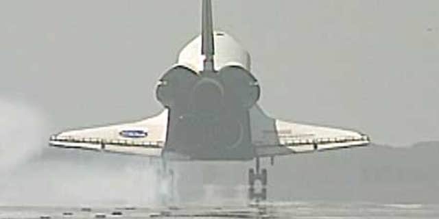 July 31: Space Shuttle Endeavour lands at the Kennedy Space Center, Florida.