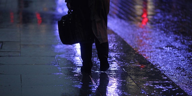 GLASGOW, SCOTLAND - NOVEMBER 01: A man walks through a rain shower in Buchanan Street on November 1, 2010 in Glasgow, Scotland. According to a poll released today, 66% of Brits will feel depressed due to it being "the most miserable day of the year". The changing of UK clocks, falling temperatures and impending government cuts factor into the research, which was carried out by the Canary Islands Tourist Board. Furthermore, Glasgow residents top the poll, followed by the people of Newcastle, Sheffield, Cardiff and London. (Photo by Jeff J Mitchell/Getty Images)