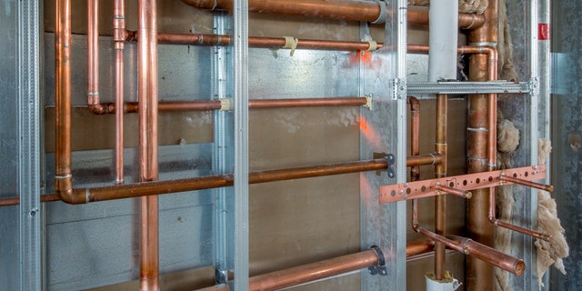 Rough-in for a commercial restroom in an office building.