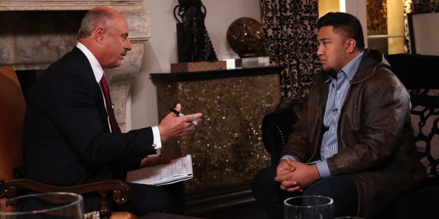 In this Jan. 24, 2013, photo provided by CBS Television Distribution/Peteski Productions, talk show host Dr. Phil McGraw, left, interviews Ronaiah Tuiasosopo during taping for the "Dr. Phil Show" in Los Angeles. The program, scheduled to air Thursday, Jan. 31, and Friday, Feb. 1, will show the first on-air interview of Tuiasosopo, the man who allegedly concocted the girlfriend hoax that ensnared Notre Dame football star Manti Te'o. (AP Photo/CBS Television Distribution/Peteski Productions)