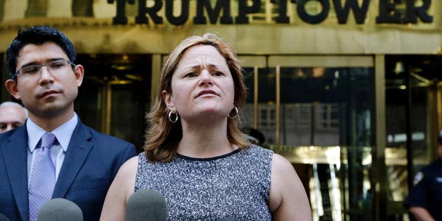 FILE - In this June 6, 2016 file photo, New York City Council Speaker Melissa Mark-Viverito, with City Councilman Carlos Menchaca, left, speaks at a news conference outside Trump Tower in New York. Donald Trump’s lightning-rod proposals to deport illegal immigrants and temporarily ban Muslims from entering the United States could cost New York state more than $800 million and New York City more 340,000 jobs, according to an analysis by Mark-Viverito. She is expected to unveil the findings in a speech Wednesday, July 13, 2016. (AP Photo/Mark Lennihan, file)