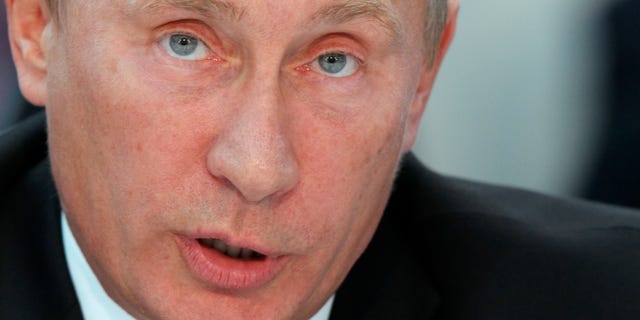 Russian Prime Minister Vladimir Putin attends a United Russia party's congress in Moscow on Friday, Sept. 23, 2011.