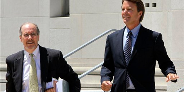 Former presidential candidate John Edwards, right, leaves federal court with attorney Jim Cooney following an appearance in Greensboro, N.C., Thursday, July 14, 2011.