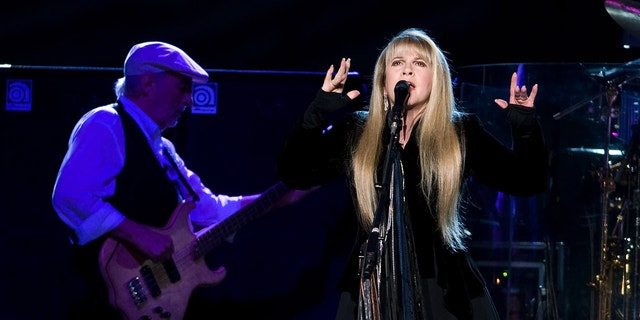 This March 19, 2009 file photo shows John McVie, left, and Stevie Nicks of Fleetwood Mac performing at Madison Square Garden in New York.