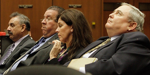 Feb. 23: Bell City executives (from r.) Administrator Robert Rizzo; former Assistant City Administrator Angela Spaccia; Luis Artiga and Oscar Hernandez listen during a preliminary hearing for the four, who are charged with misappropriation of public funds in Los Angeles.