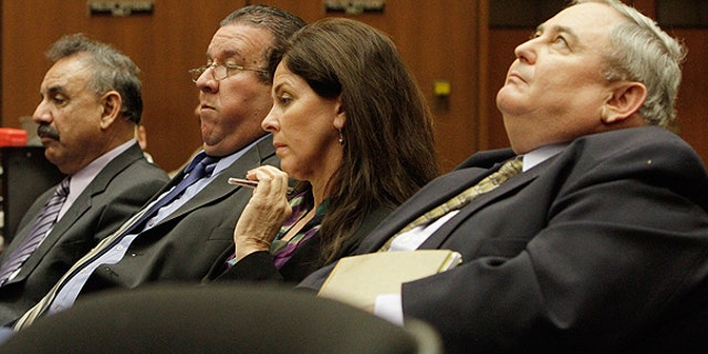 Feb. 23: Bell City executives (from r.) Administrator Robert Rizzo; former Assistant City Administrator Angela Spaccia; Luis Artiga and Oscar Hernandez listen during a preliminary hearing for the four, who are charged with misappropriation of public funds in Los Angeles.