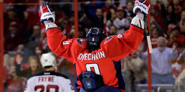 Washington Capitals left wing Alex Ovechkin, from Russia, celebrates after his second goal of the game in the third period of an NHL hockey game against the New Jersey Devils Saturday, Feb. 23, 2013 in Washington. The Capitals won 5-1. (AP Photo/Alex Brandon)
