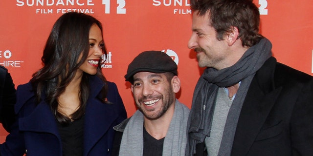 Actress Zoe Saldana, left, co-writer and co-director Lee Sternthal, center, and actor Bradley Cooper pose at the premiere of "The Words" during the 2012 Sundance Film Festival in Park City, Utah on Friday, Jan. 27, 2012. (AP Photo/Danny Moloshok)