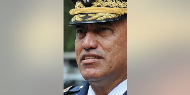 In this July 24, 2013 photo, Honduras Police Chief, Gen. Juan Carlos Bonilla, speaks to the press in Tegucigalpa, Honduras. The five-star general was accused a decade ago of running deaths squads and today oversees a department suspected of beating, killing and “disappearing” its detainees. He also is the top cop in the country that serves as a way station for most South American cocaine bound for the United States and beyond. Bonilla is also the U.S. government’s go-to man in Honduras for the war on drug trafficking. (AP Photo/Fernando Antonio)