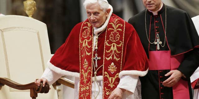 Pope Benedict XVI flanked by personal secretary Archbishop Georg Gaenswein during a mass.