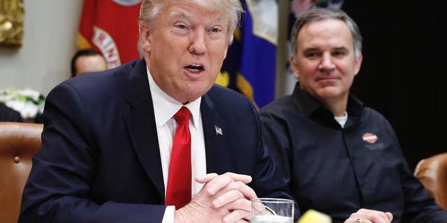 President Donald Trump, joined by Harley Davidson President and CEO Matt Levatich, talks to media before a lunch meeting with Harley Davidson executives and union representatives in the Roosevelt Room of the White House in Washington, Thursday, Feb. 2, 2017. (AP Photo/Carolyn Kaster)