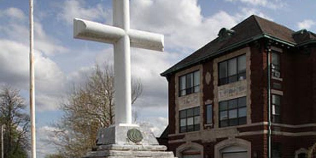 A national atheist organization is seeking to remove this cross from a 91-year-old war memorial in Woonsocket, R.I., claiming it violates separation of church and state.