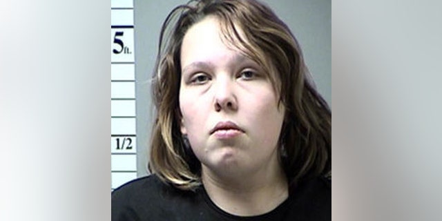 Megan Hendricks, 21, allegedly witnessed the child abuse by Burnette, but did not call for help, reports said.