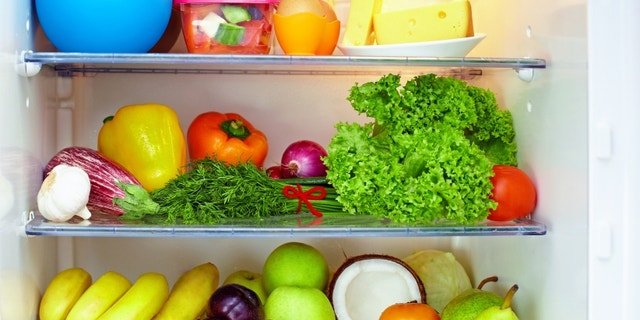 refrigerator full of healthy food. friuts and vegetables