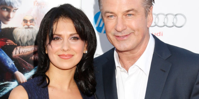 FILE - This Nov. 4, 2012 file photo shows actor Alec Baldwin, right, and his wife Hilaria Thomas at the "Rise Of The Guardians'" special screening during the 2012 AFI FEST at Grauman's Chinese Theatre in the Hollywood section of Los Angeles. A representative for Alec Baldwin says the "30 Rock" star and his wife Hilaria are expecting their first child together. Baldwin, 54, is already the father of a 17-year-old daughter, Ireland, from his previous marriage to actress Kim Basinger (Photo by Todd Williamson/Invision/AP, file)