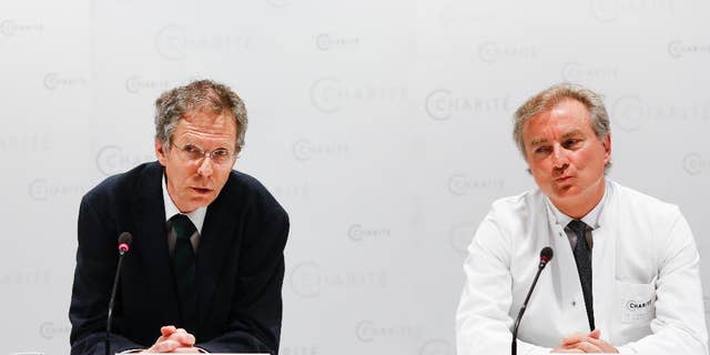 FILE - In this May 27, 2015 file photo Christoph Buehrer, left, director of neonatology at Charite Hospital and Wolfgang Henrich, director of gynecology at Charite Hospital, brief the media about the situation of 65-year old mother Annegret Raunigk and her quadruplets, in Berlin, Germany. Doctors said Wednesday, June 17, 2015 quadruplets born prematurely a month ago to a 65-year-old woman in Germany are doing well and gaining weight but one remains on a respirator. (AP Photo/Markus Schreiber, file)