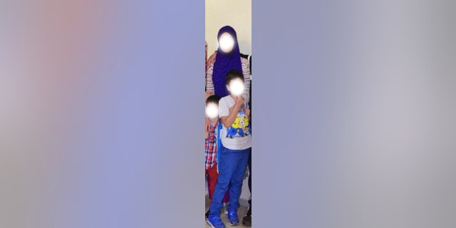 Ayşe and her youngest son, Ali, spent months in a Turkish prison before fleeing to Greece.