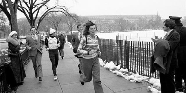Sen. Edward M. Kennedy, D-Mass, and his sister, Eunice Shriver, jogged and walked a mile on the Ellipse Thursday, Feb. 6, 1975 in Washington to kick off a 3,182-mile fund-raising jaunt for the benefit of the Special Olympics sports program for mentally challenged youngsters. (AP Photo/BD)