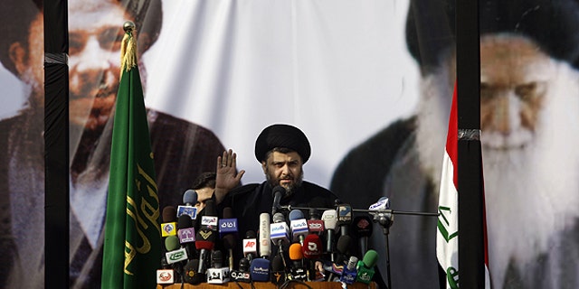 Jan. 8: Shiite cleric Muqtada al-Sadr gestures during his first public appearance since returning from nearly four years of self-imposed exile in Najaf, south of Baghdad, Iraq.