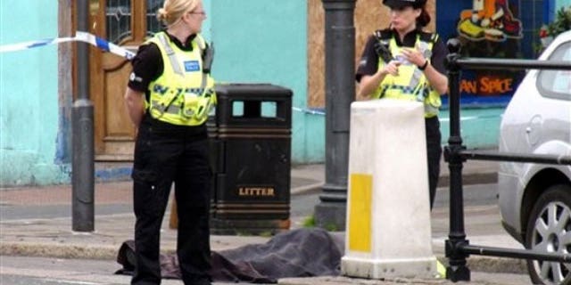 June 2: Police stand next to a body following a shooting on Duke Street, in the town of Whitehaven in northwest England. British police were hunting down a man suspected in a shooting spree that has left more than one person dead in northwest England. The Cumbria Constabulary said there have been "a number of fatalities" as well as several injuries after shots were fired in the town of Whitehaven and nearby Seascale and Egremont (AP).