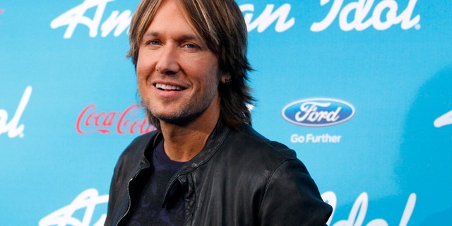 Country singer and judge Keith Urban poses at the party for the finalists of the television show "American Idol" in Los Angeles, California March 7, 2013.