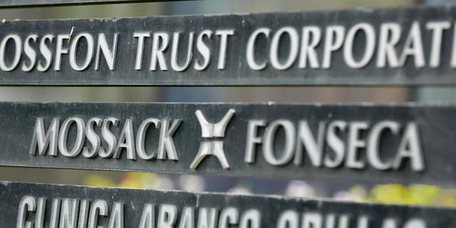 FILE - In this April 4, 2016 file photo, a marquee of the Arango Orillac Building lists the Mossack-Fonseca law firm, in Panama City. Prosecutors in Panama said on Saturday, Feb. 11, 2017 they’ve formally arrested the two partners of the Mossack-Fonseca law firm involved in last year’s "Panama Papers" scandal, in which thousands of pages of documents related to offshore accounts were leaked. The arrests are for money laundering related to another scandal involving bribes paid by the Brazilian company Odebrecht. (AP Photo/Arnulfo Franco, File)