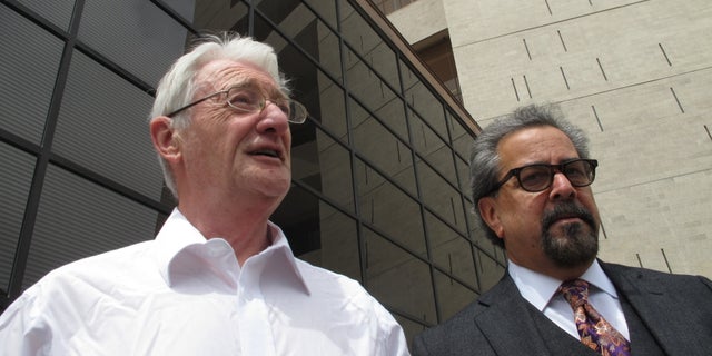 FILE - In this April 25, 2012 file photo, British businessman Christopher Tappin, left, leaves federal court with one of his lawyers, Kent Schaffer, in El Paso, Texas. A U.S. judge on Wednesday, Jan. 9, 2013 is expected to sentence the 65-year-old Tappin, who pleaded guilty in November to trying to buy missile parts and resell them to Iran. (AP Photo/Juan Carlos Llorca, File)