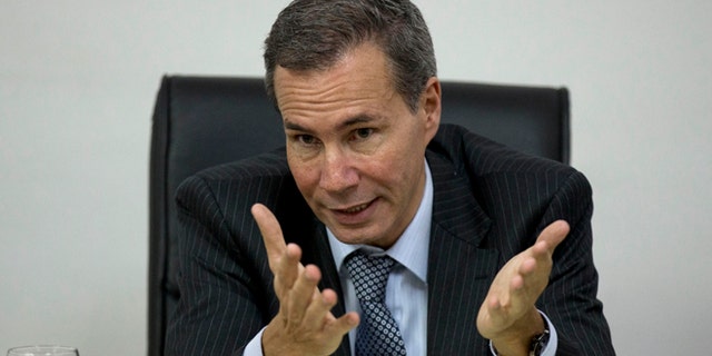 FILE - In this May 29, 2013, file photo, Alberto Nisman, the prosecutor investigating the 1994 bombing of the Argentine-Israeli Mutual Association community center, talks to journalists in Buenos Aires, Argentina. Nisman who accused the government of secret deals with Iran over the investigation was found shot dead at his apartment early Monday Jan. 19, 2014. He was due to participate in a closed-door session with Congress over his claim last week that Argentine President Cristina Fernandez and Foreign Minister Hector Timerman covered up a deal with Iran. (AP Photo/Natacha Pisarenko, File)