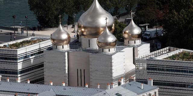 This photo taken on Sept.28, 2016 shows the he new Russian Holy Trinity orthodox cathedral in Paris. Russian President Vladimir Putin had planned to attend the inauguration ceremony at the Russian Orthodox Spiritual and Cultural Center Wednesday Oct. 19, 2016 in the heart of the French capital but postponed his visit to Paris following a spat with French leader Francois Hollande over the war in Syria. (AP Photo/Christophe Ena)