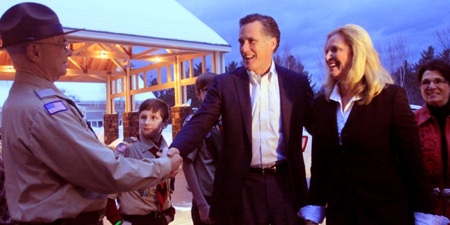 FILE: Former Massachusetts Gov. Mitt Romney and his wife, Ann, are greeted in Bartlett, N.H. on March 5.