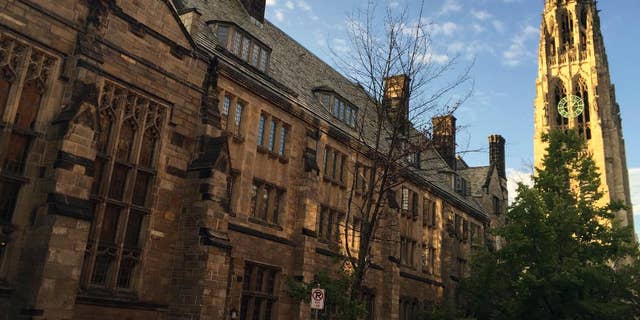 FILE - This Sept. 9, 2016 photo shows Harkness Tower on the campus of Yale University in New Haven, Conn. Harvard University is taking new steps to confront its past ties to slavery. The Ivy League school is hosting a conference Friday, March 3, 2017, exploring the historical ties between slavery and early universities, including Harvard. (AP Photo/Beth J. Harpaz, File)