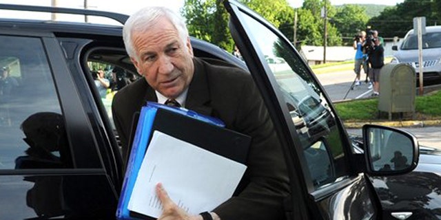 June 14, 2012: Former Penn State University assistant football coach Jerry Sandusky arrives for the fourth day of his trial at the Centre County Courthouse in Bellefonte, Pa.