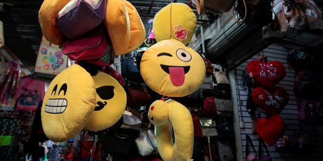 File photo: A woman sells emoji cushions at the Oriental market in Managua, Nicaragua, May 19,2017. (REUTERS/Oswaldo Rivas)
