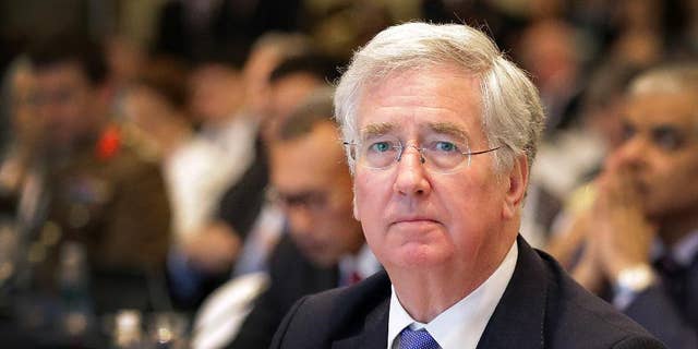 FILE - This is a Saturday, June 4, 2016  file photo of British Defense Secretary Michael Fallon as he attends the 15th International Institute for Strategic Studies Shangri-la Dialogue, or IISS, Asia Security Summit  in Singapore. Michael Fallon said Monday July 18, 2016 that Britain will have to work harder to maintain its military and political influence on the global stage after it leaves the European Union. ﻿﻿ (AP Photo/Wong Maye-E, File)
