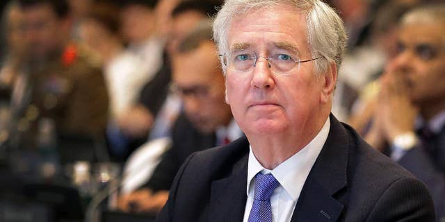 FILE - This is a Saturday, June 4, 2016 file photo of British Defense Secretary Michael Fallon as he attends the 15th International Institute for Strategic Studies Shangri-la Dialogue, or IISS, Asia Security Summit in Singapore. Michael Fallon said Monday July 18, 2016 that Britain will have to work harder to maintain its military and political influence on the global stage after it leaves the European Union. (AP Photo/Wong Maye-E, File)