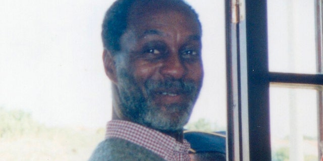 In this photo released by Noticias de Colares on Thursday Sept. 29, 2011, U.S. fugitive George Wright is seen in a post office in Praia das Macas, Portugal in 2000.