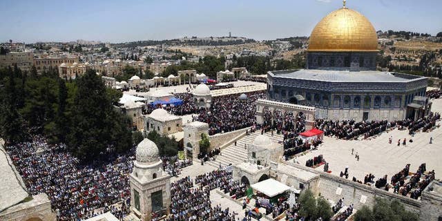 FILE - In this June 17, 2016 file photo, Palestinians pray in the Al Aqsa Mosque compound during the Muslim holy month of Ramadan, in Jerusalem's Old City. The Palestinians are ringing alarm bells over Donald Trump's stated intention to relocate the U.S. Embassy in Israel to contested Jerusalem, fearing quick action once he takes office as U.S. president next week. They say an embassy move would kill any hopes for negotiating an Israeli-Palestinian border deal and rile the region by undercutting Muslim and Christian claims to the holy city. (AP Photo/Mahmoud Illean, File)