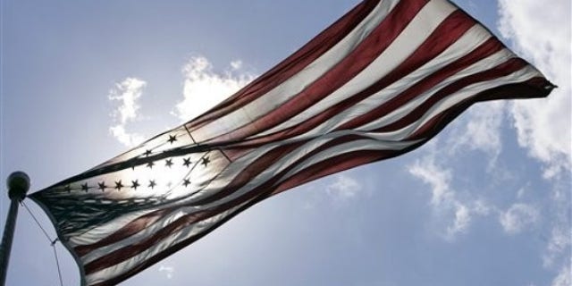 An American Flag flies at Liberty State Park in Jersey City, N.J., Tuesday, June 30, 2009. (AP Photo/Mel Evans)