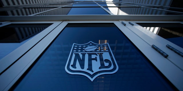 The NFL logo appears on an entrance door to the football stadium at Super Bowl XLII in Glendale, Arizona February 2, 2008. New England Patriots will play the New York Giants in the NFL's Super Bowl XLII football game at the stadium on Sunday. REUTERS/Mike Blake (UNITED STATES) - RTR1WL8P