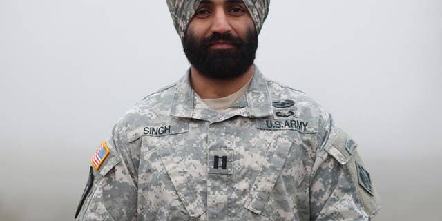 This photo provided by the Sikh Coalition shows Army Capt. Simratpal Singh. When Singh entered the U.S. Military Academy at West Point back in 2006, he did something he thought he would never have to: shave his beard. "One of the hardest things I had to do was look in the mirror every day and shave," said Singh, whose Sikh religion requires men to grow beards as an article of faith. Now Singh and three Army enlistees have won permission to wear beards and turbans after filing federal lawsuits that seek to force the Pentagon to accommodate those who wear beards for religious reasons. Singh, won an administrative exception under an Army policy that allows exemptions to the no-beard policy on a case-by-case basis. (Jovelle Tamayo/Sikh Coalition via AP)